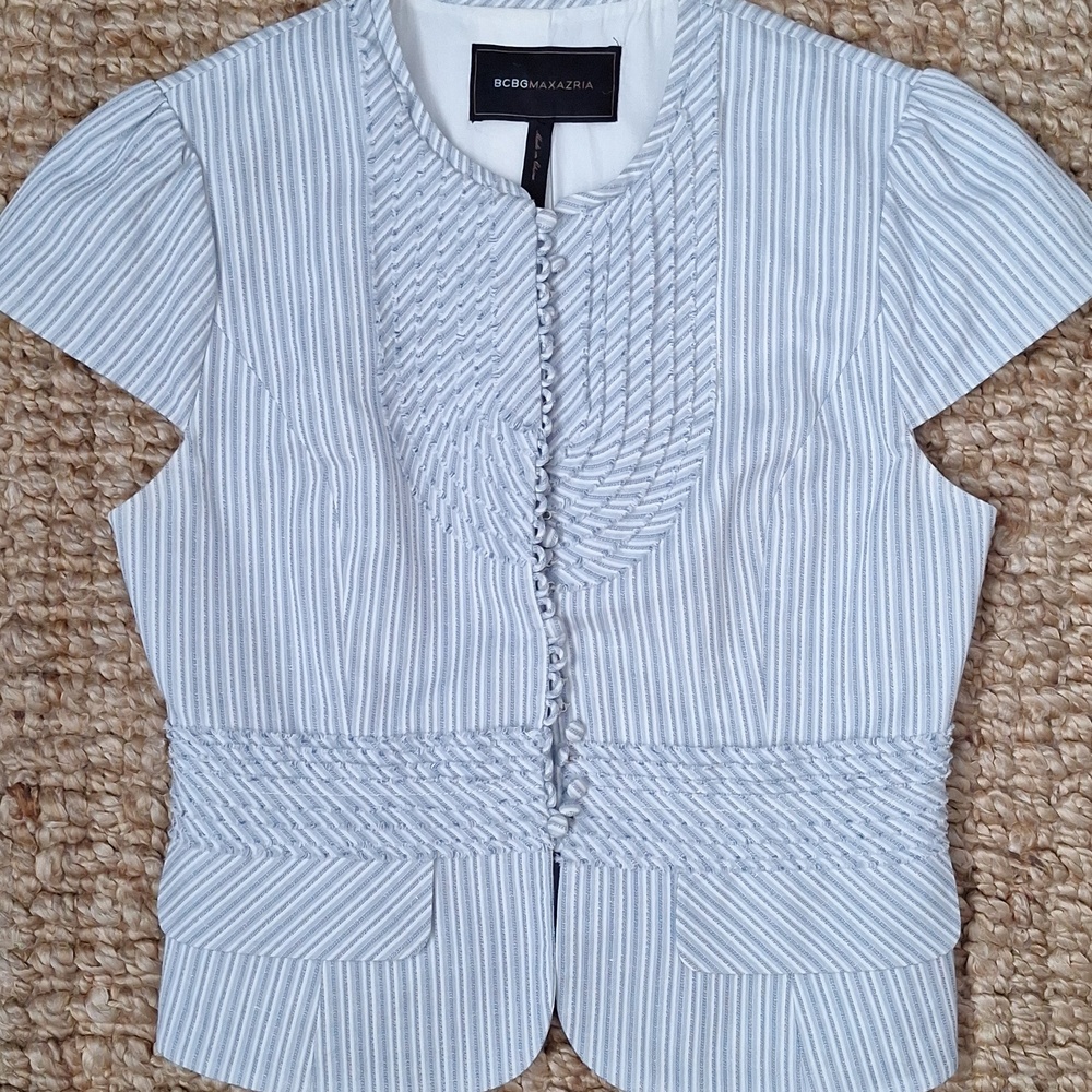 Cropped, striped jacket by BCBG MaxAzria featuring ruffled detailing and button